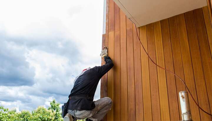 Professional wood siding installation being installed on a beautiful historic home.